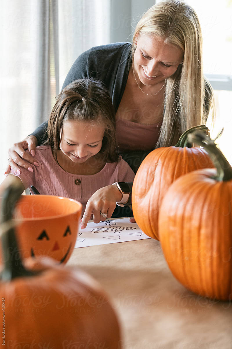 Mother And Daughter Draw Pumpkin Face