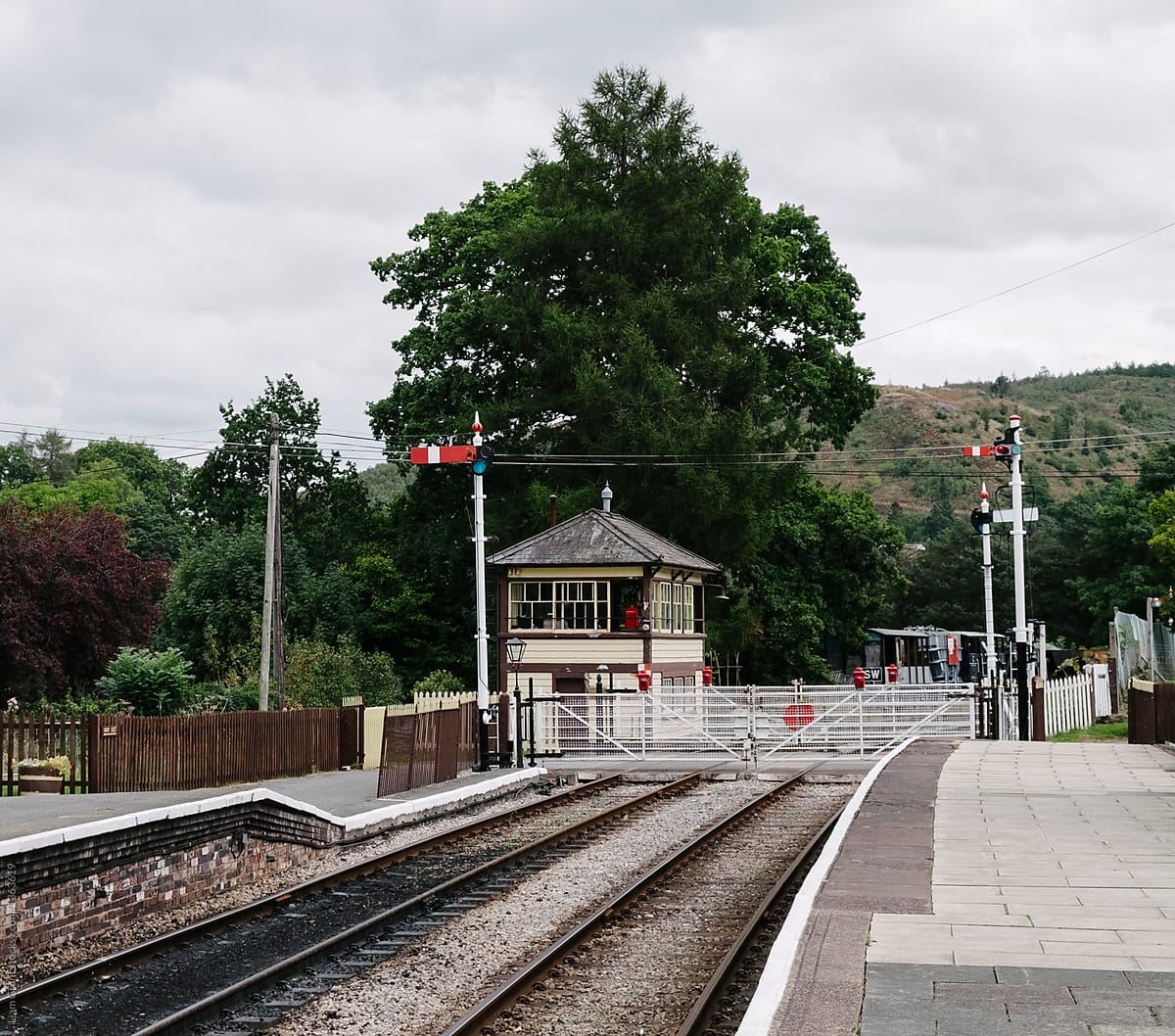 Signal box and road crossing on a heritage railway line. Wales,