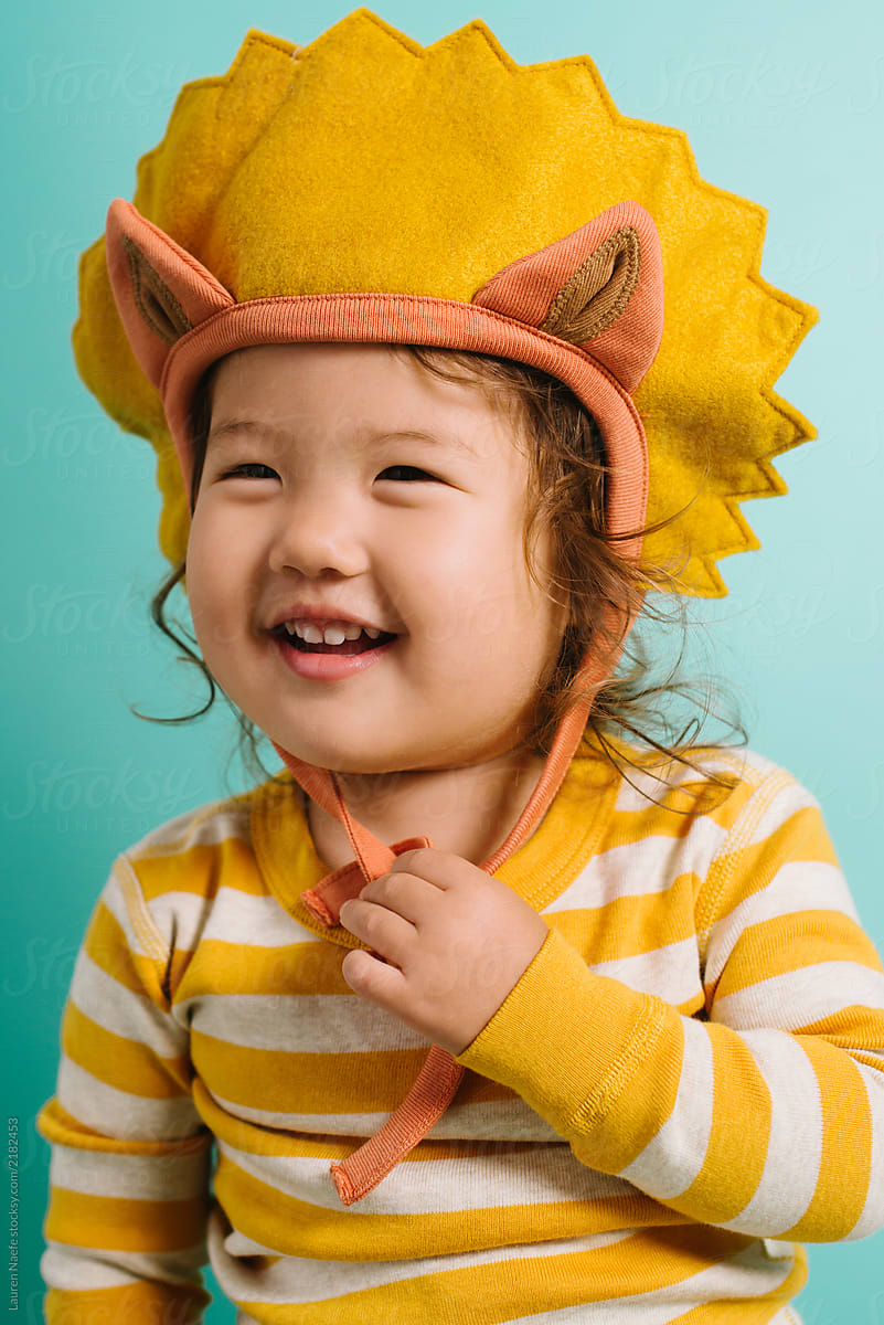Portrait of toddler in lion costume