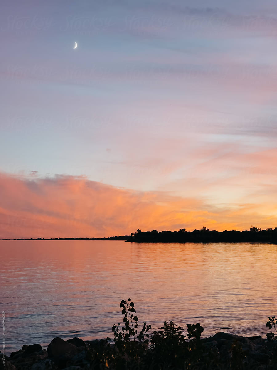 Sunset and crescent moon over Lake Ontario