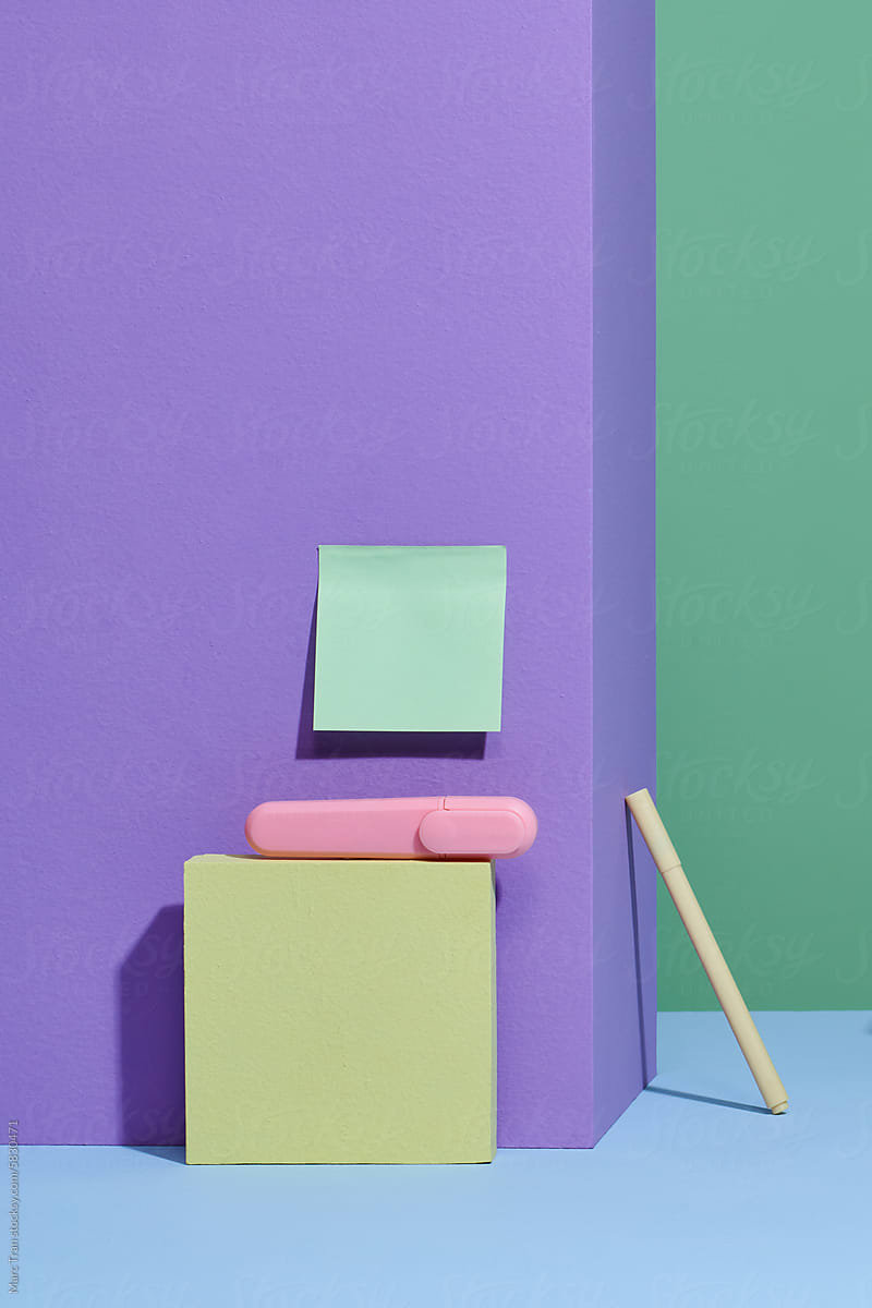 square notes are attached to the wall with colorful workplace