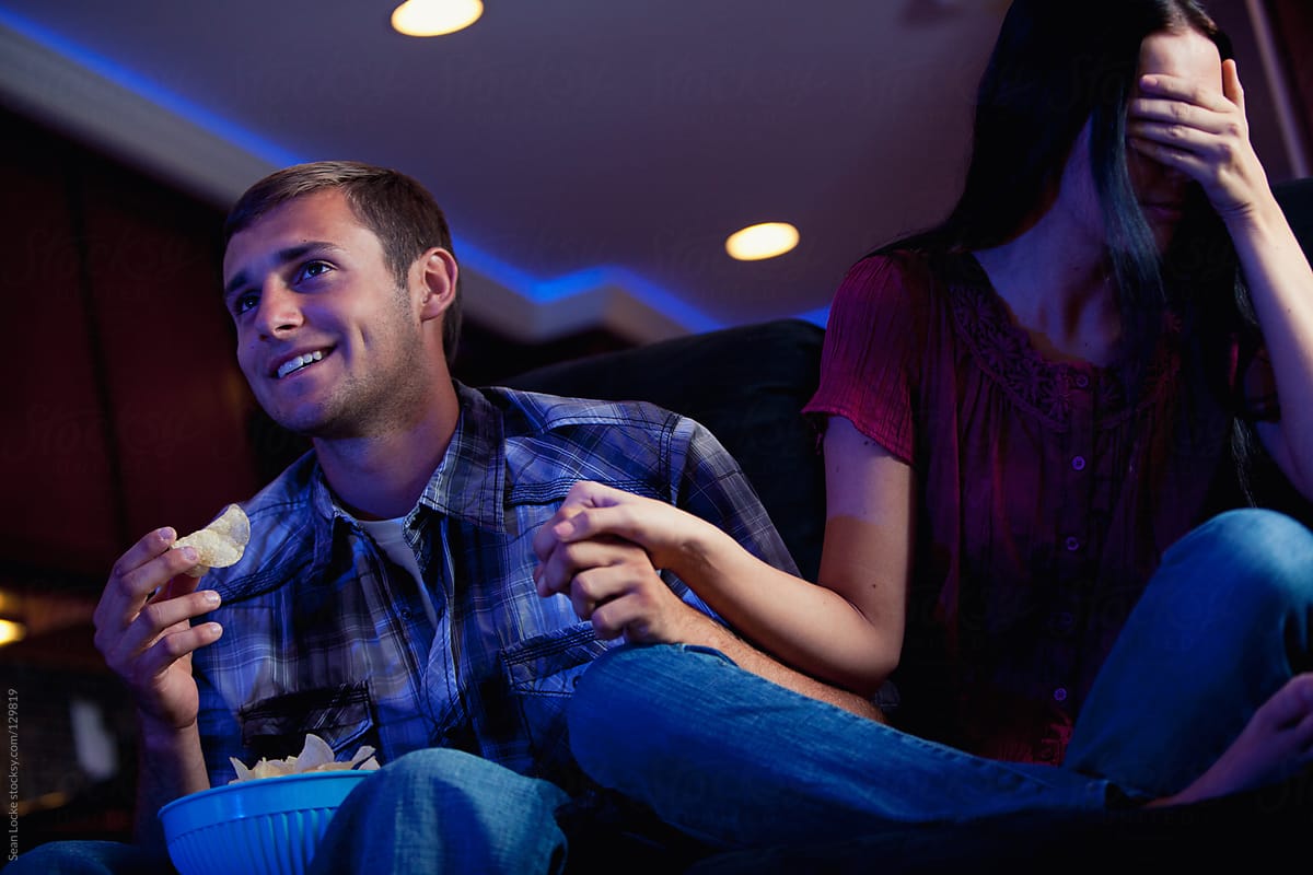 Television: Guy Enjoying Scary Movie With Girlfriend