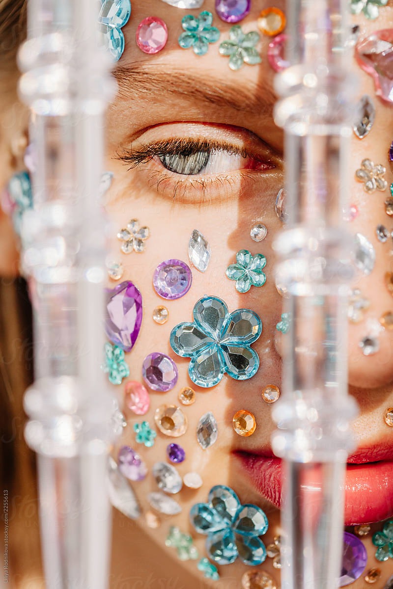 Closeup beauty portrait of face with crystals and transparent decor