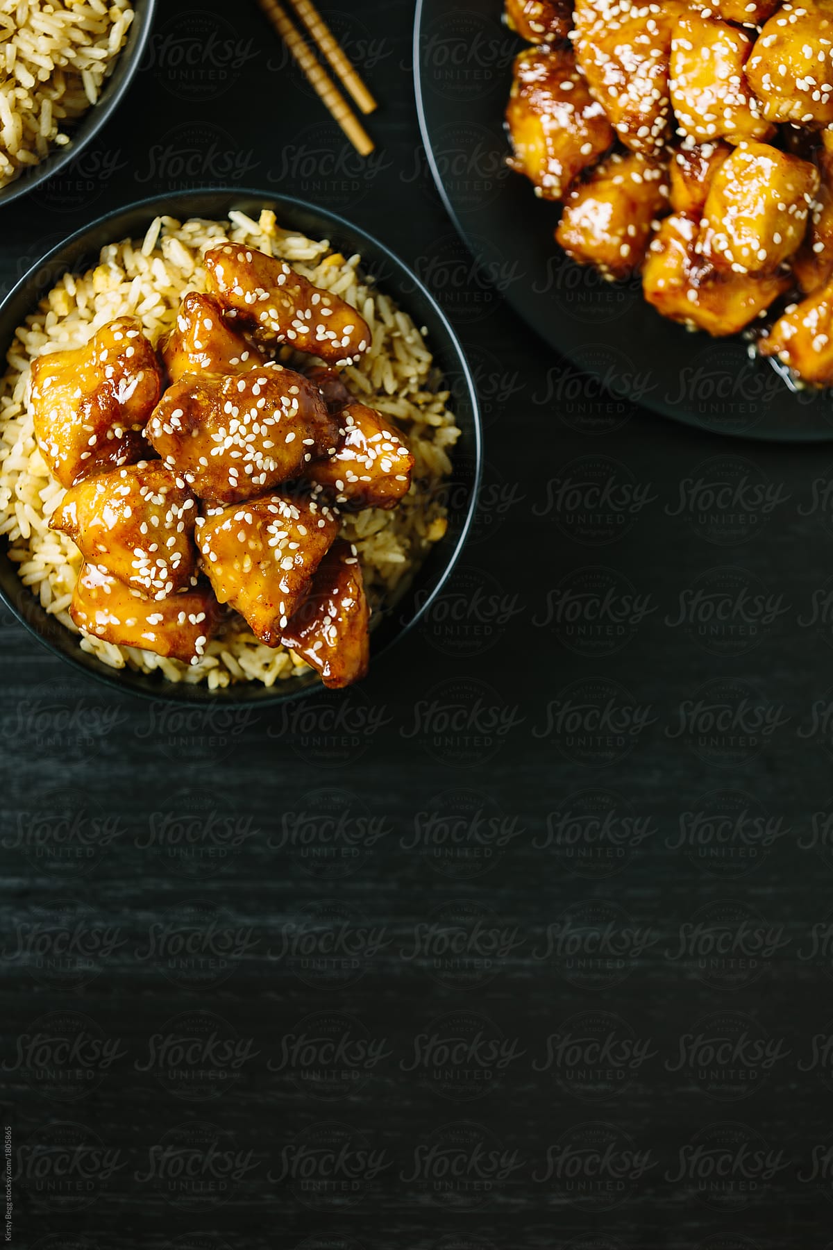 Copy space next to sesame chicken on rice