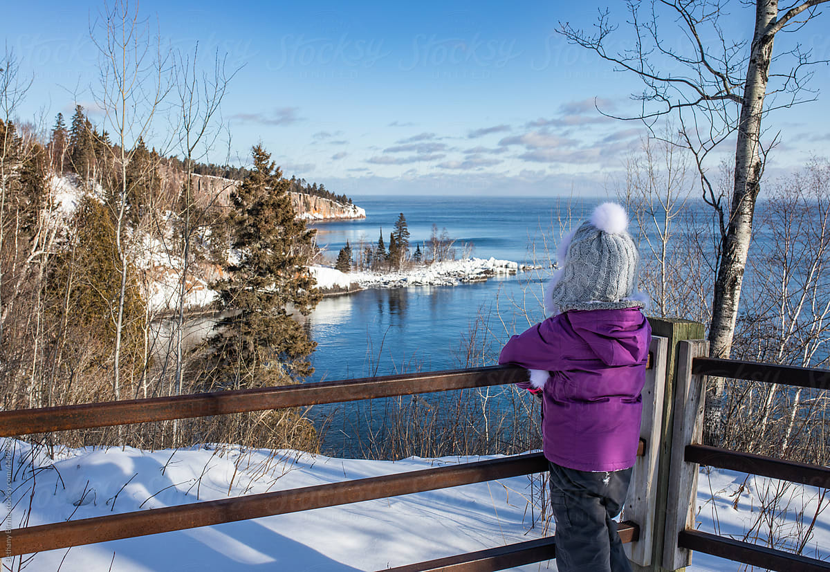 Girl outside looking over Lake Superior