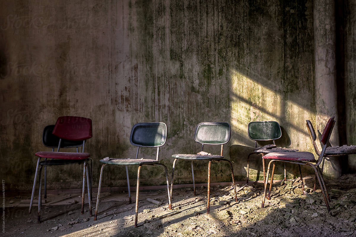 abandoned teaching room with colorful chairs