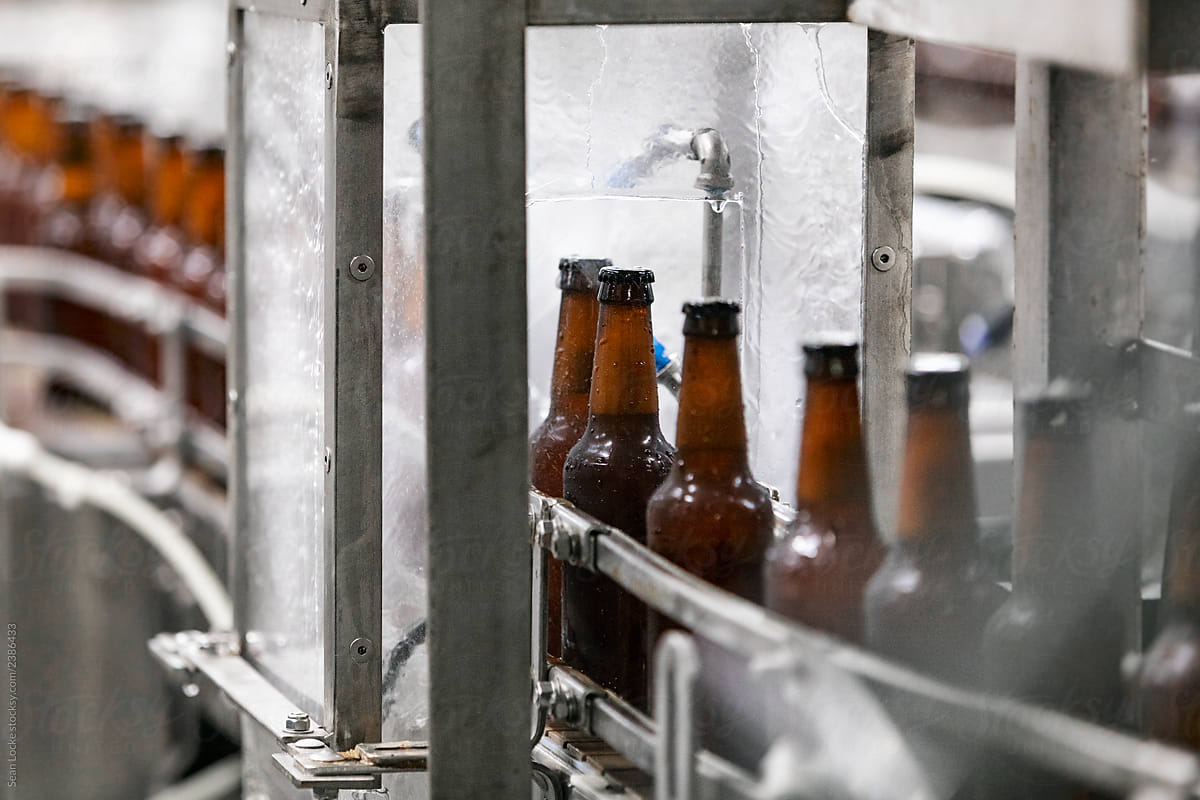 Brewery: Beer Bottles Move Through Water Sprayers