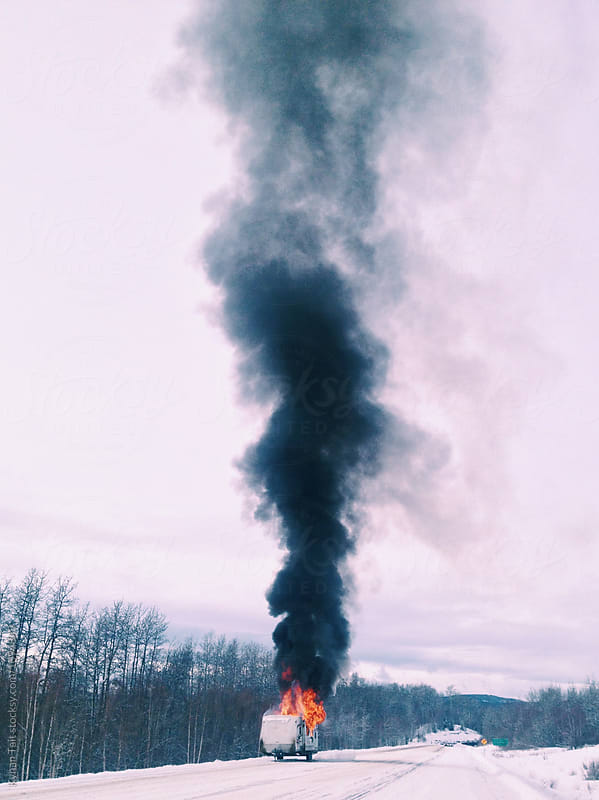 Trailer fire on a snowy highway - Stock Image - Everypixel