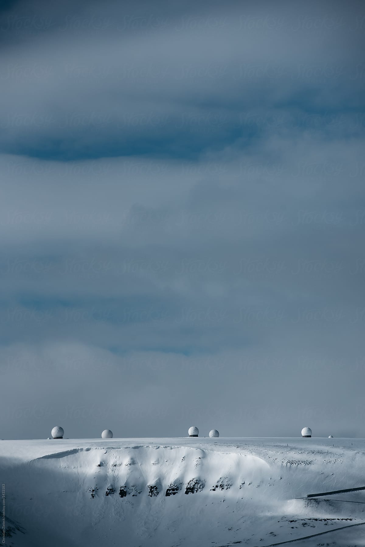Radio domes against cloudy winter sky