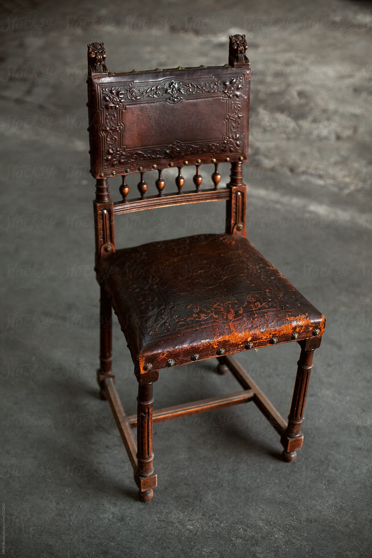 old wooden chair with leather upholsterymem studio