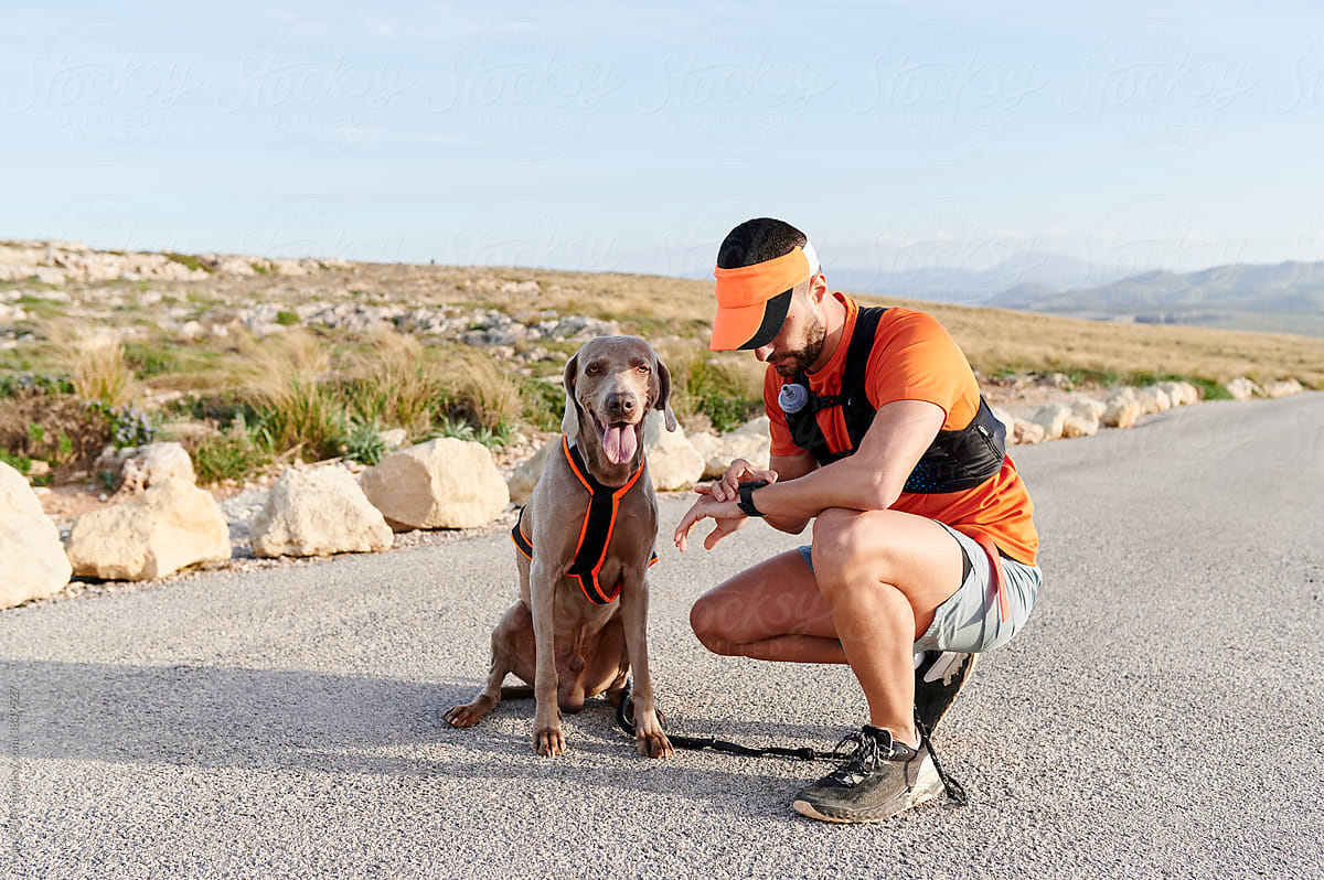 Man and his dog preparing for a run