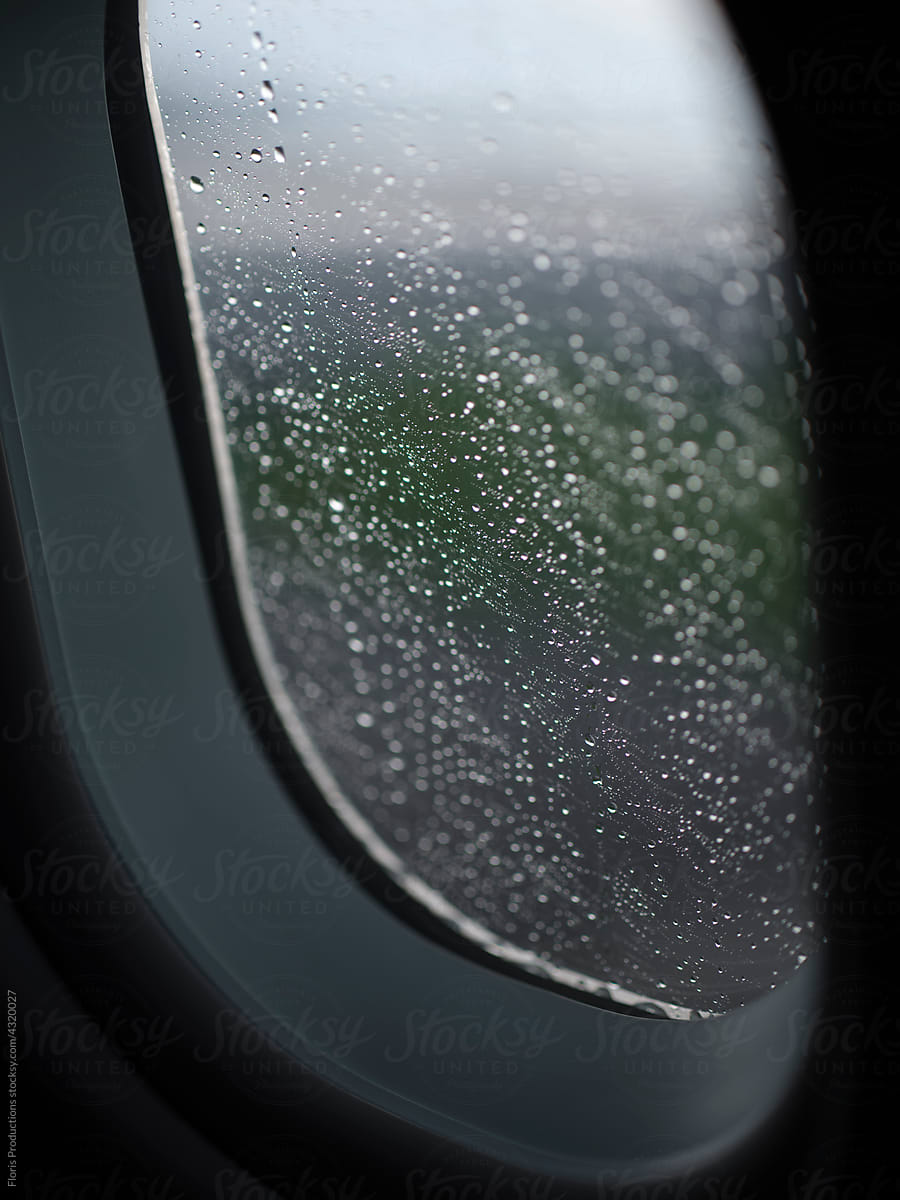 airplane window during rain