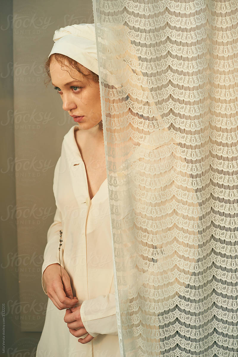 A portrait of a beautiful girl in a white shawl