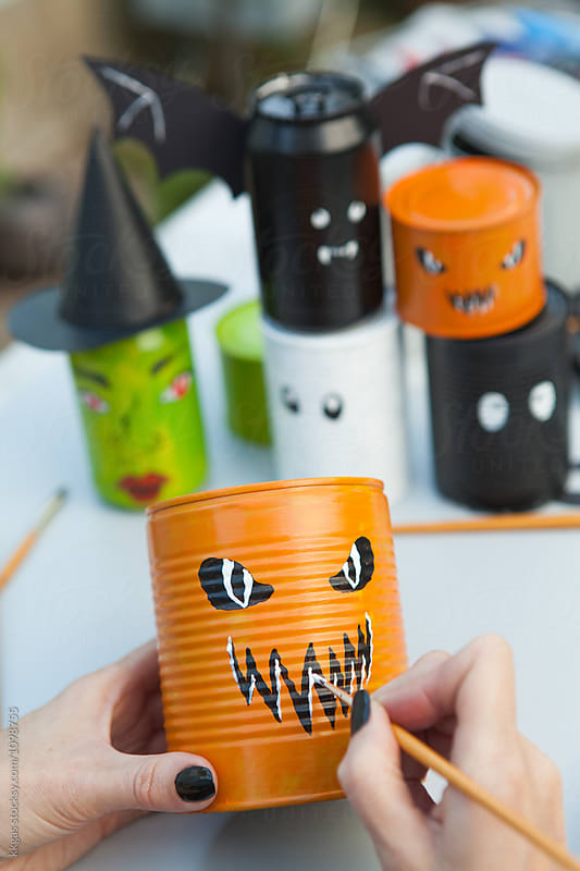 Cans being decorated for halloween games