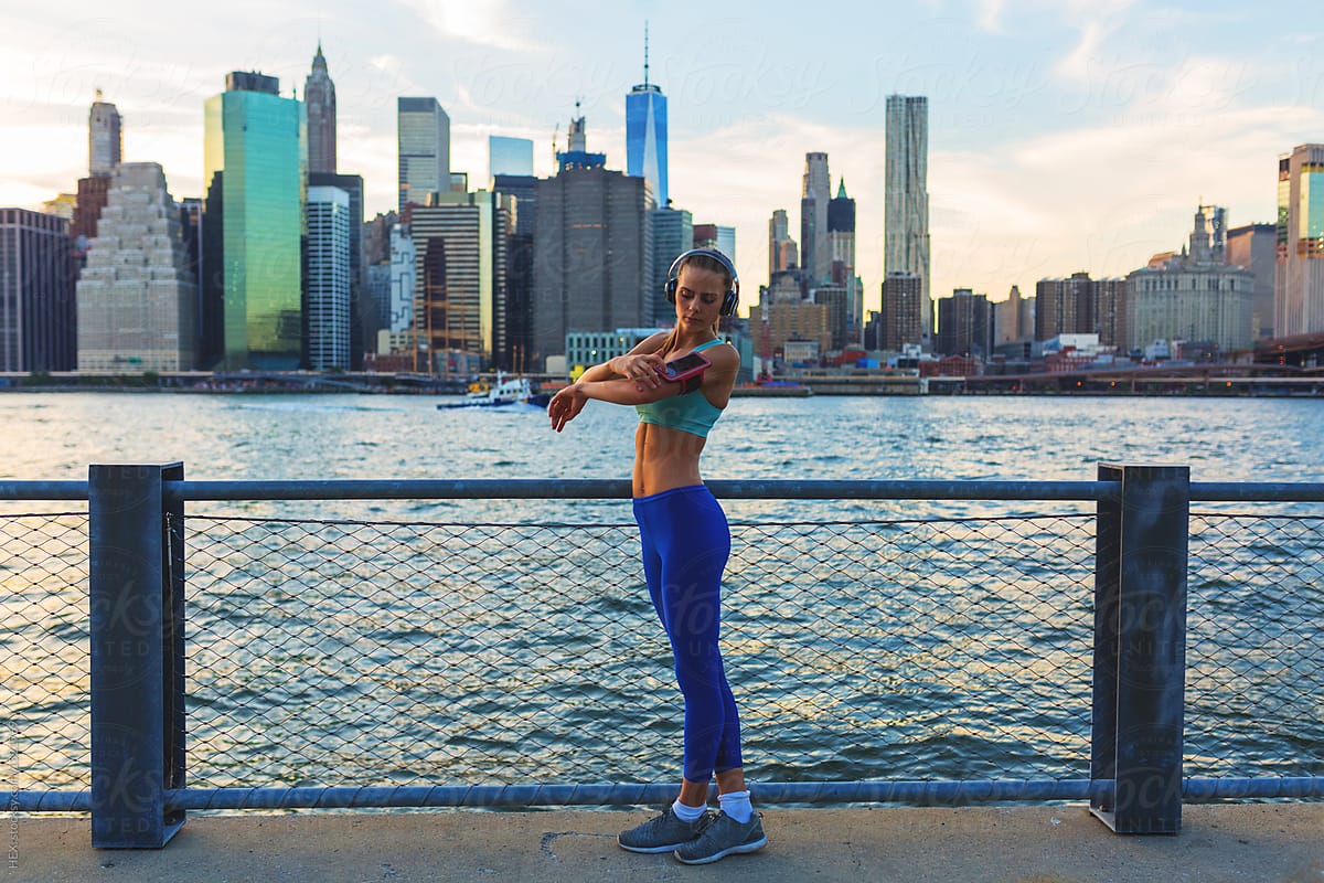 Young Beautiful Woman Running in New York City. Manhattan Skyline