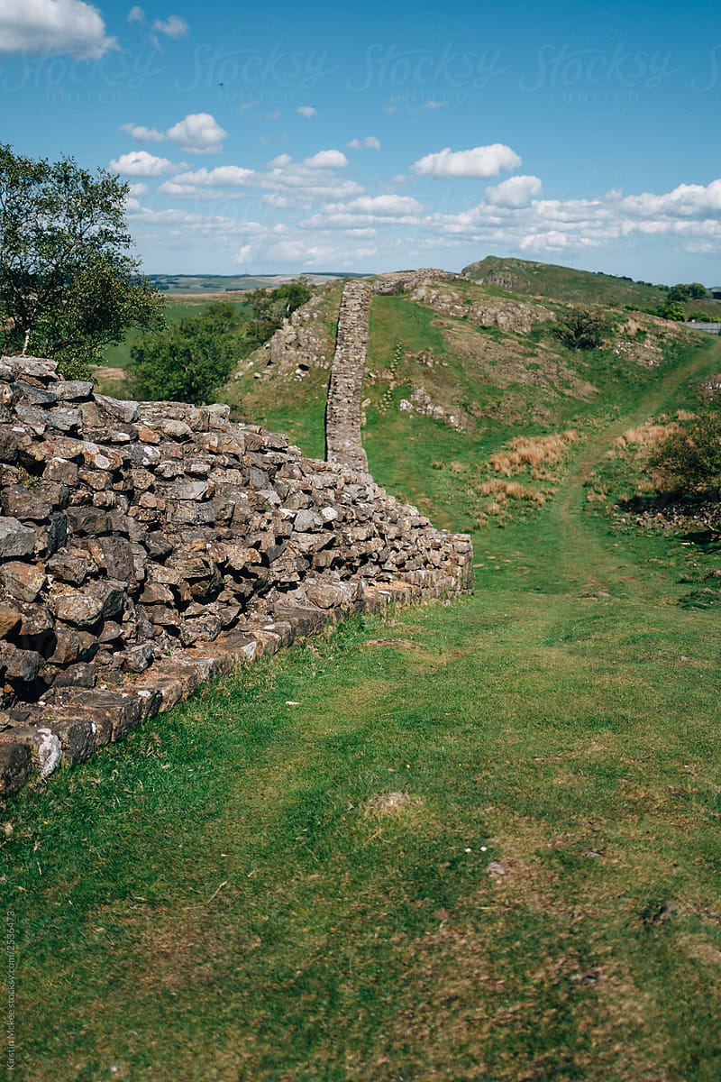 Winding Hadrian\'s wall with clouds as background