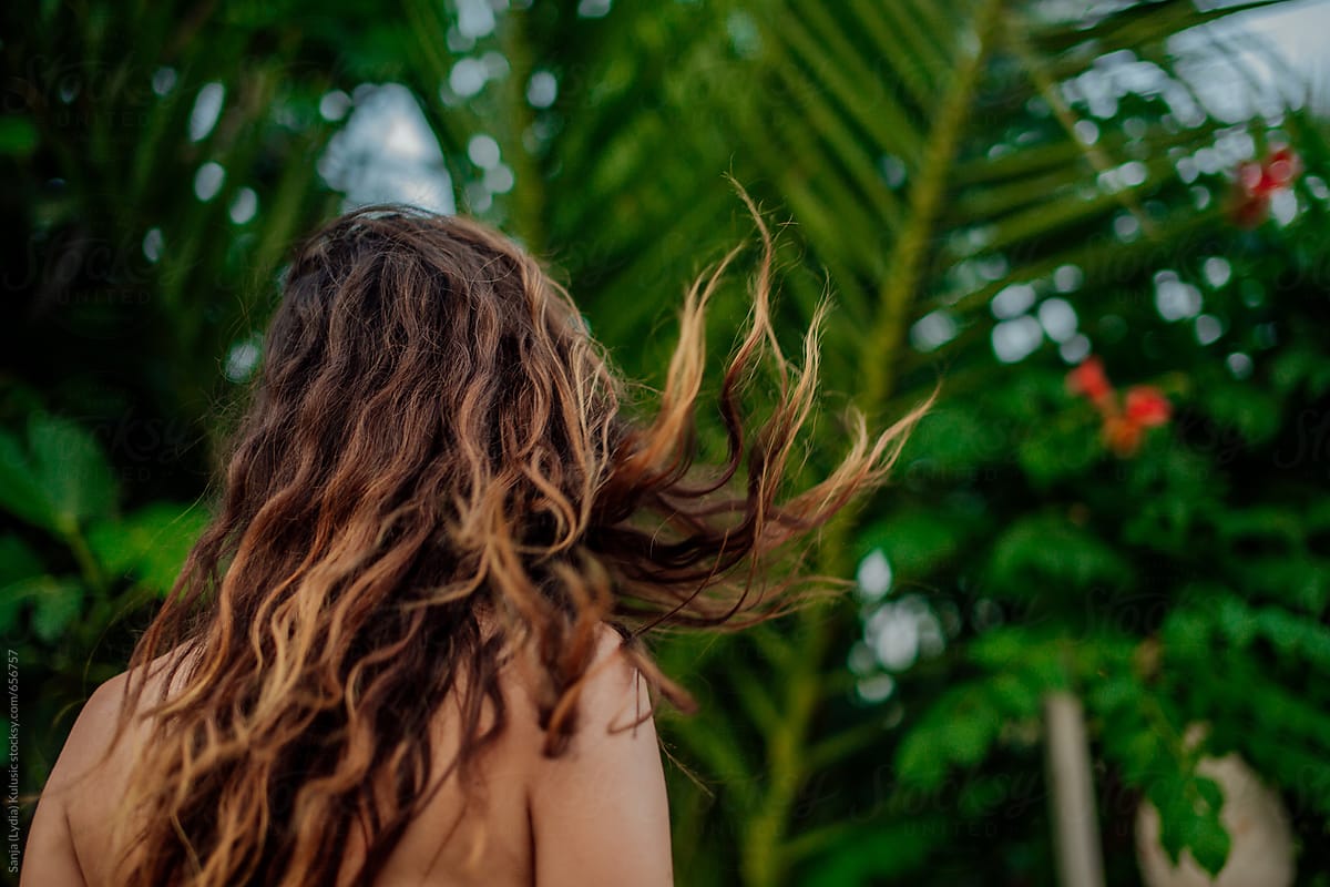 Brown Ombre Summer Hair Flying In The Air With A Green Palms In A 