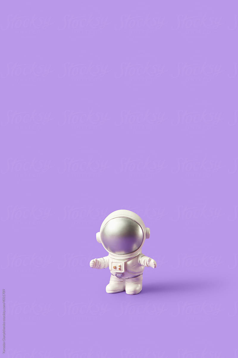 Toy astronaut standing with open arms