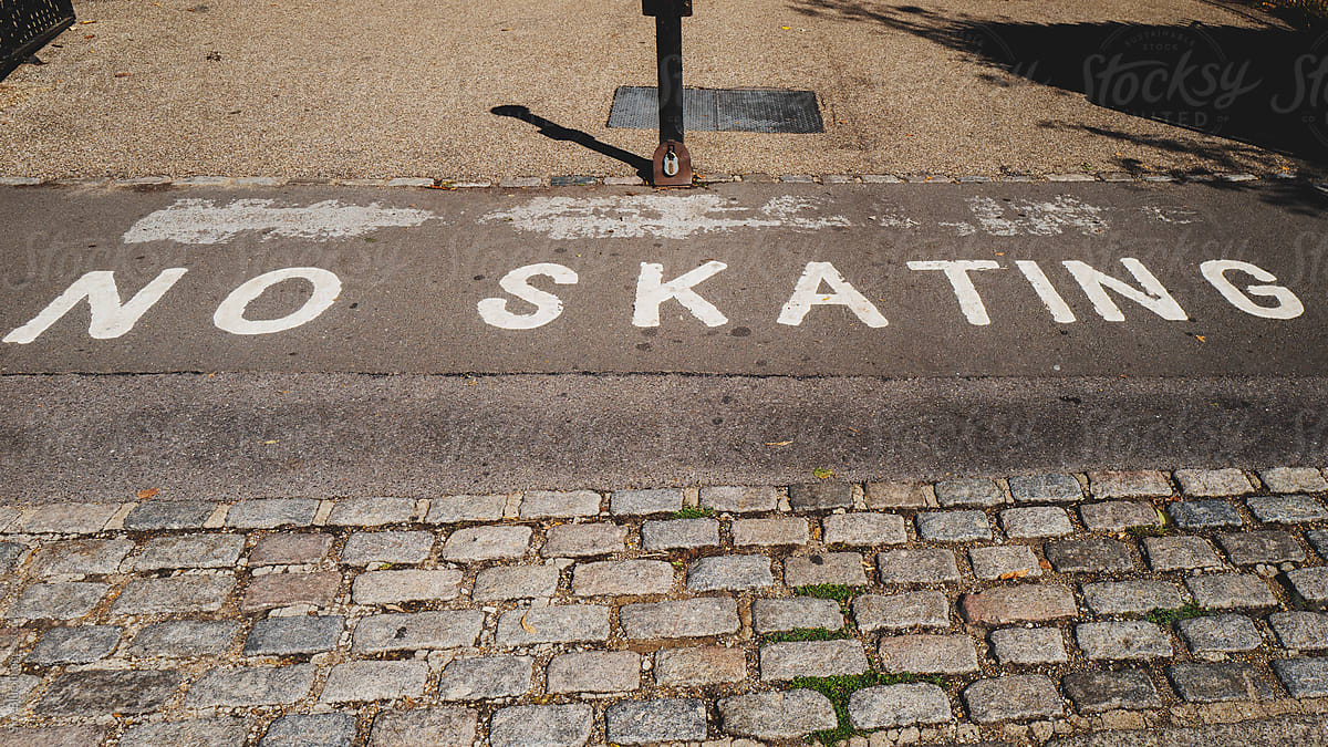 No Skating written on sidewalk