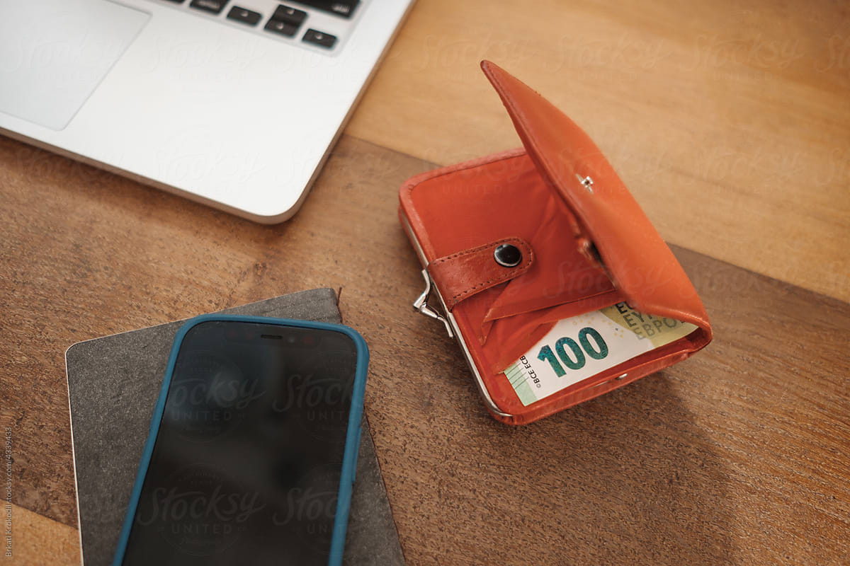 Wallet With Euro Bills Cash Next To A Phone