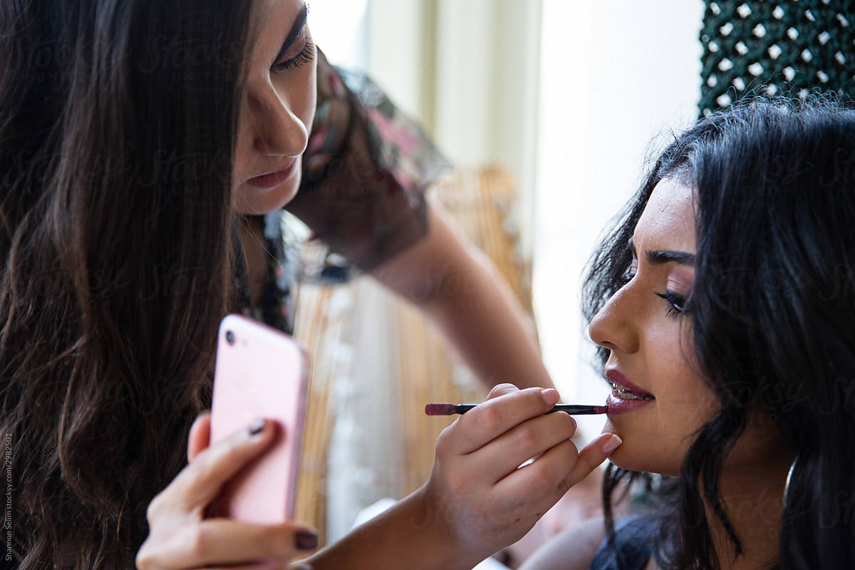 Egyptian Makeup Artist applying lip color