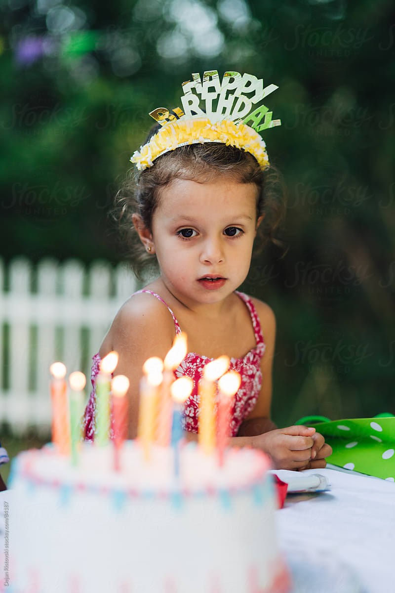 Child sitting on a birthday party