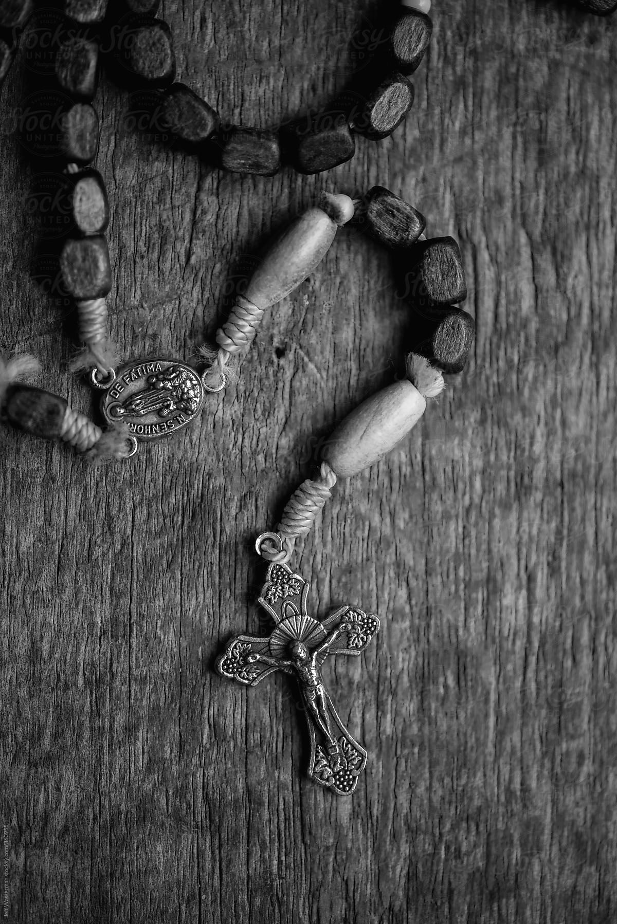 Rosary on Rustic Wood