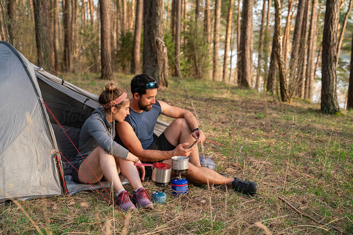 Happy Couple Camping In The Forest