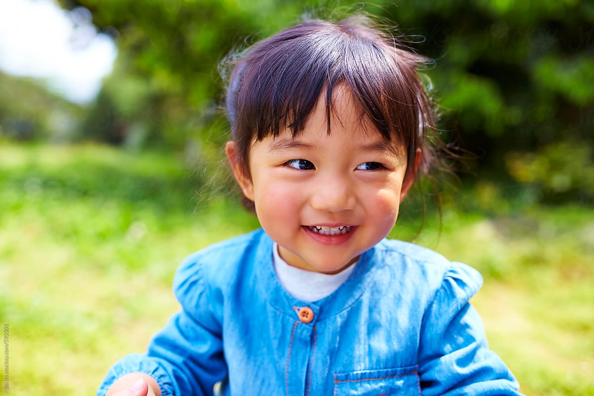 happy little asian girl outdoor