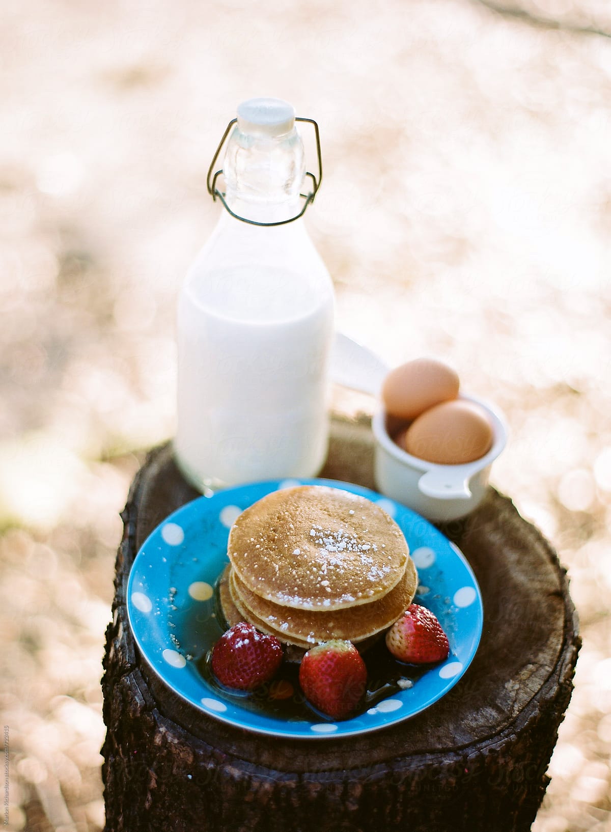 Pancakes, milk eggs, and strawberries