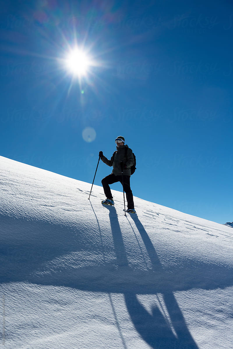 Man climbing in mountains in winter