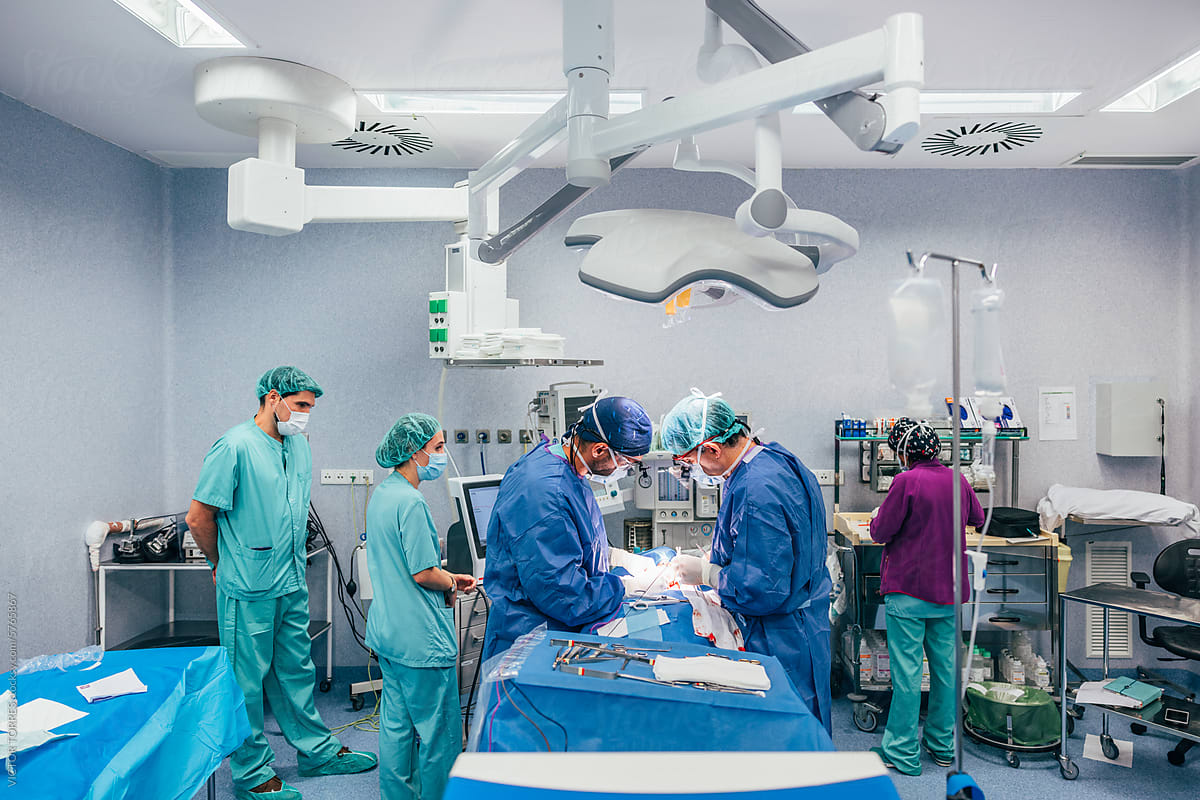 Surgical team performing an operation in a modern OR