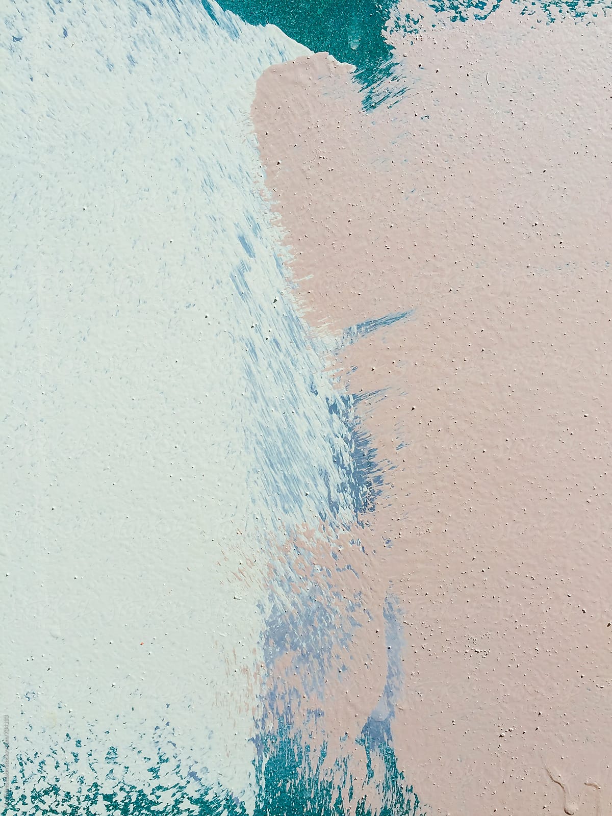 Detail of paint covering graffiti tags on metal wall