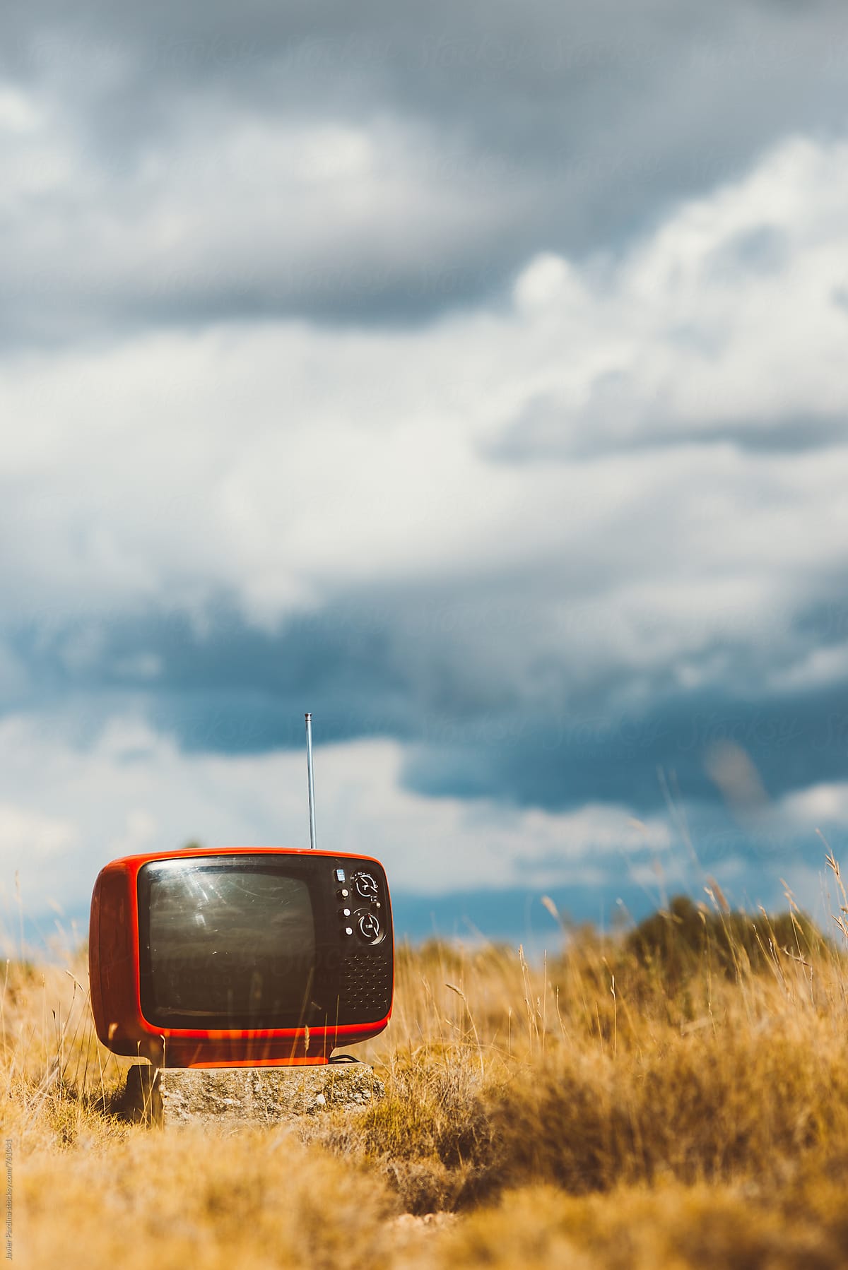 old TV in the dry field