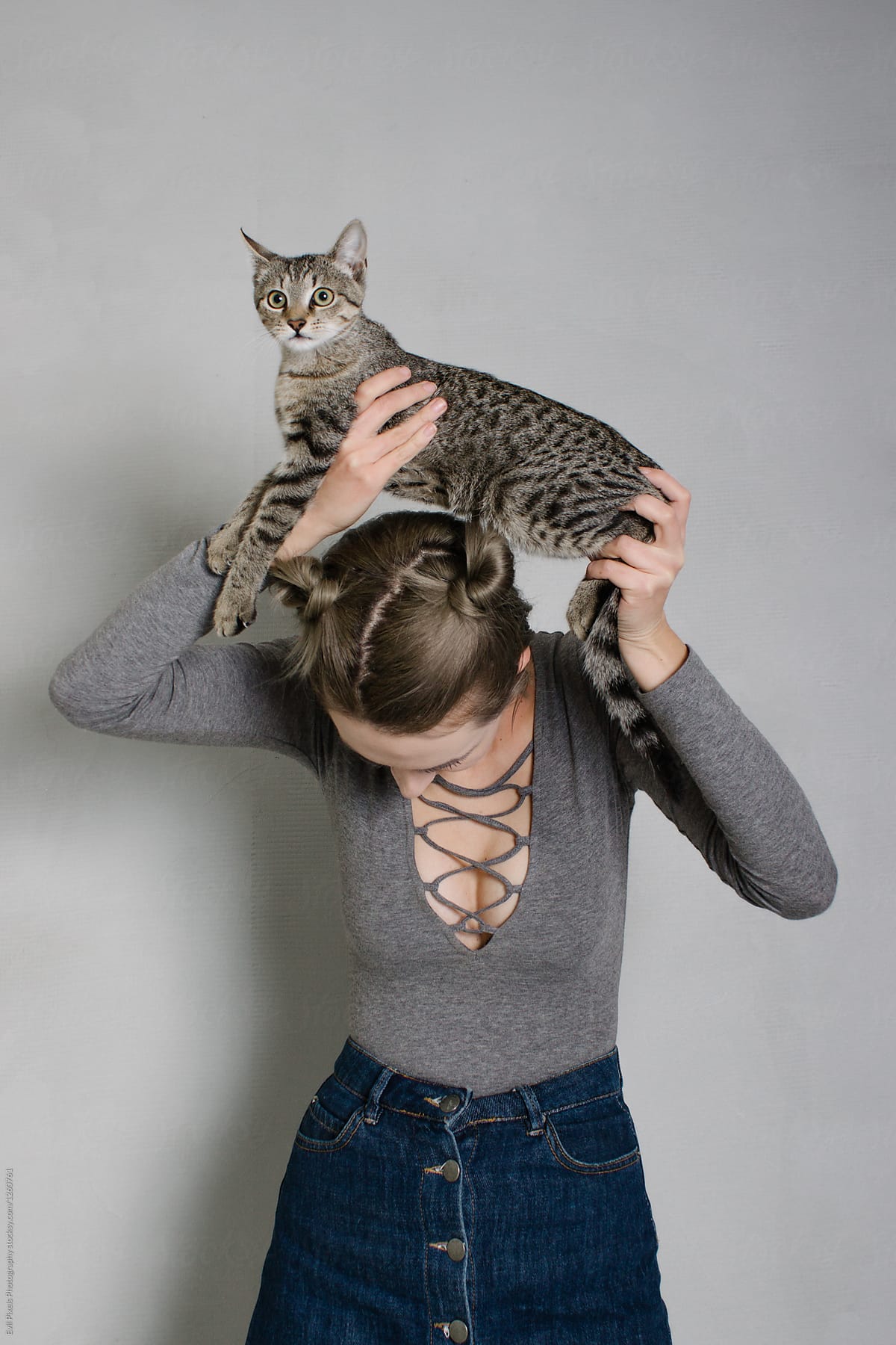 Portrait of a young female model with her cat