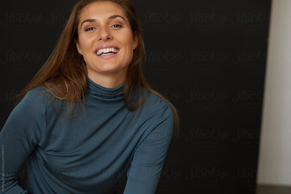 Smiling woman on a black background
