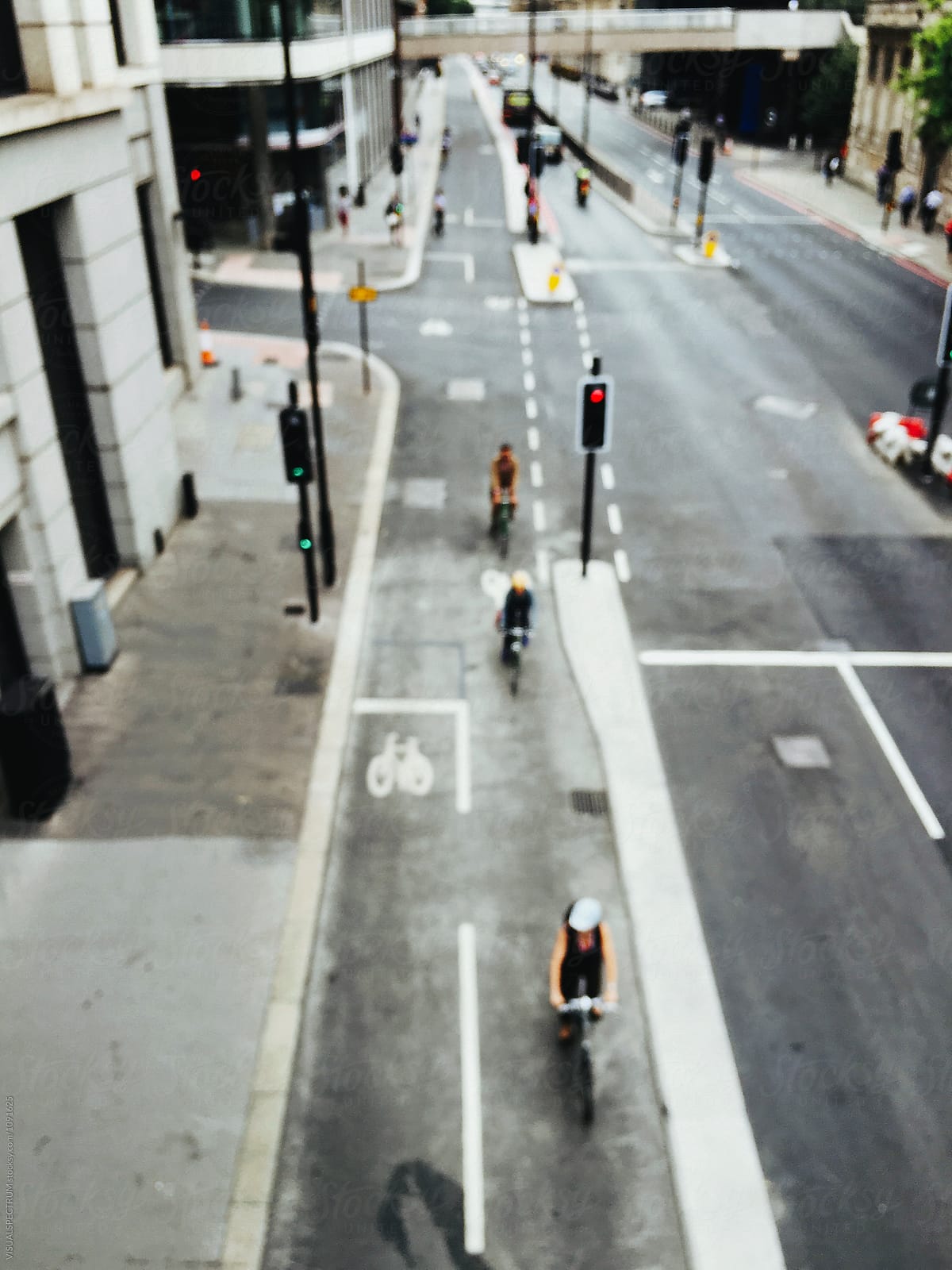 City of London - Defocused Overhead Shot of Cyclists Riding Through Inner City