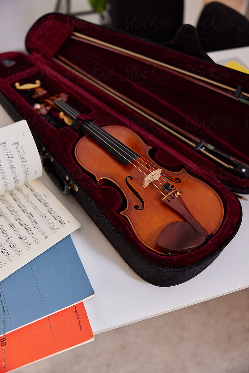 Violin and sheet music on table