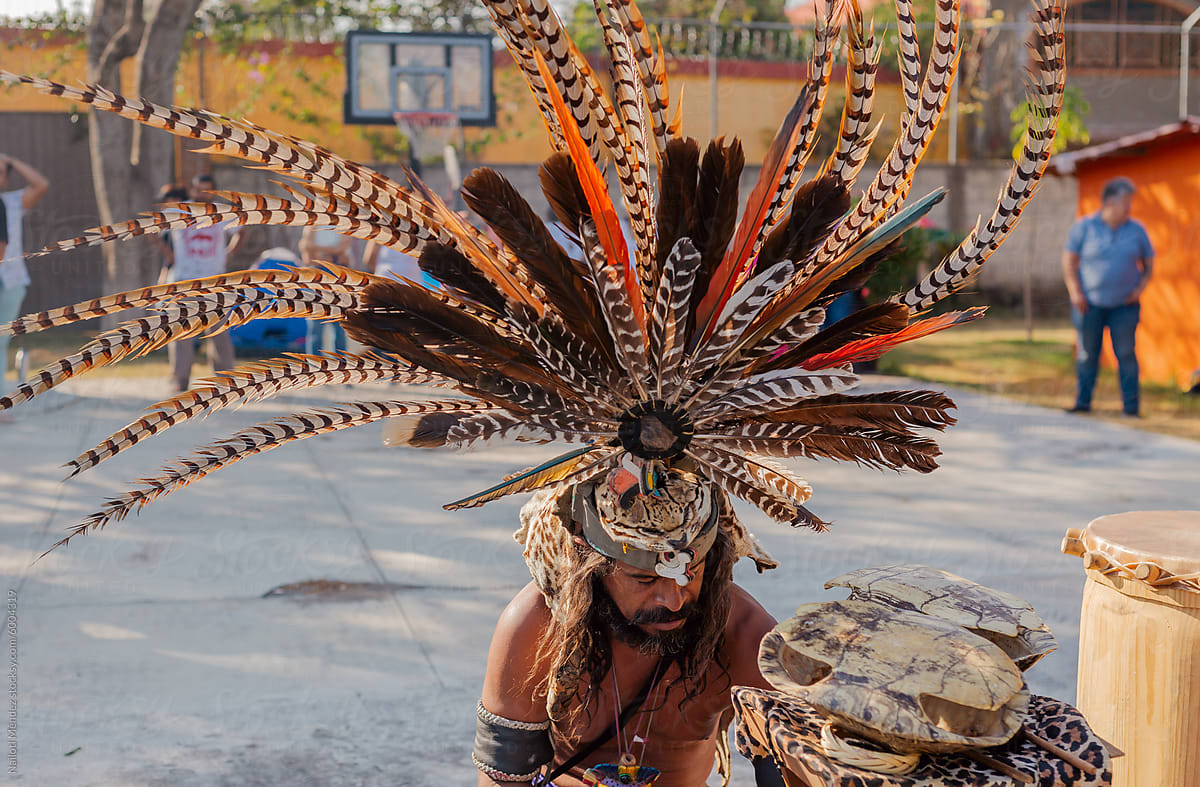 Pre-Hispanic dancer with feather headdress.