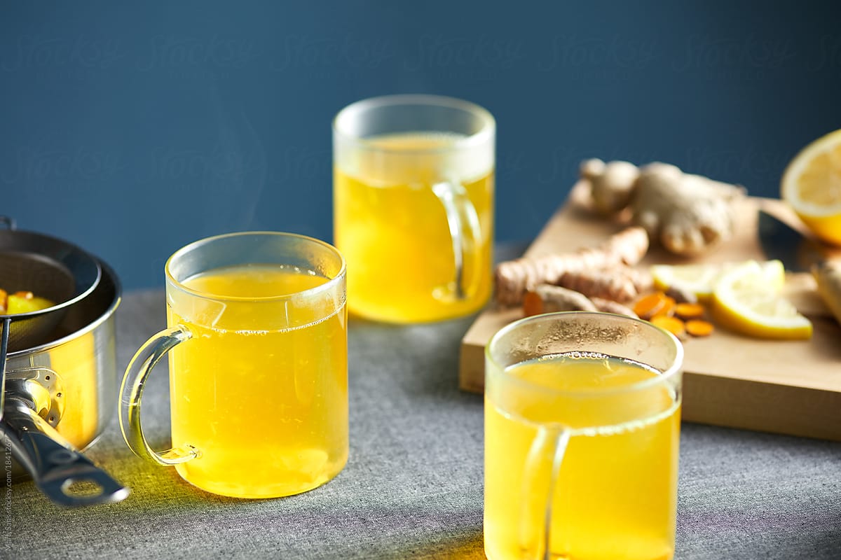 Infusion with turmeric, lemon and ginger in glasses