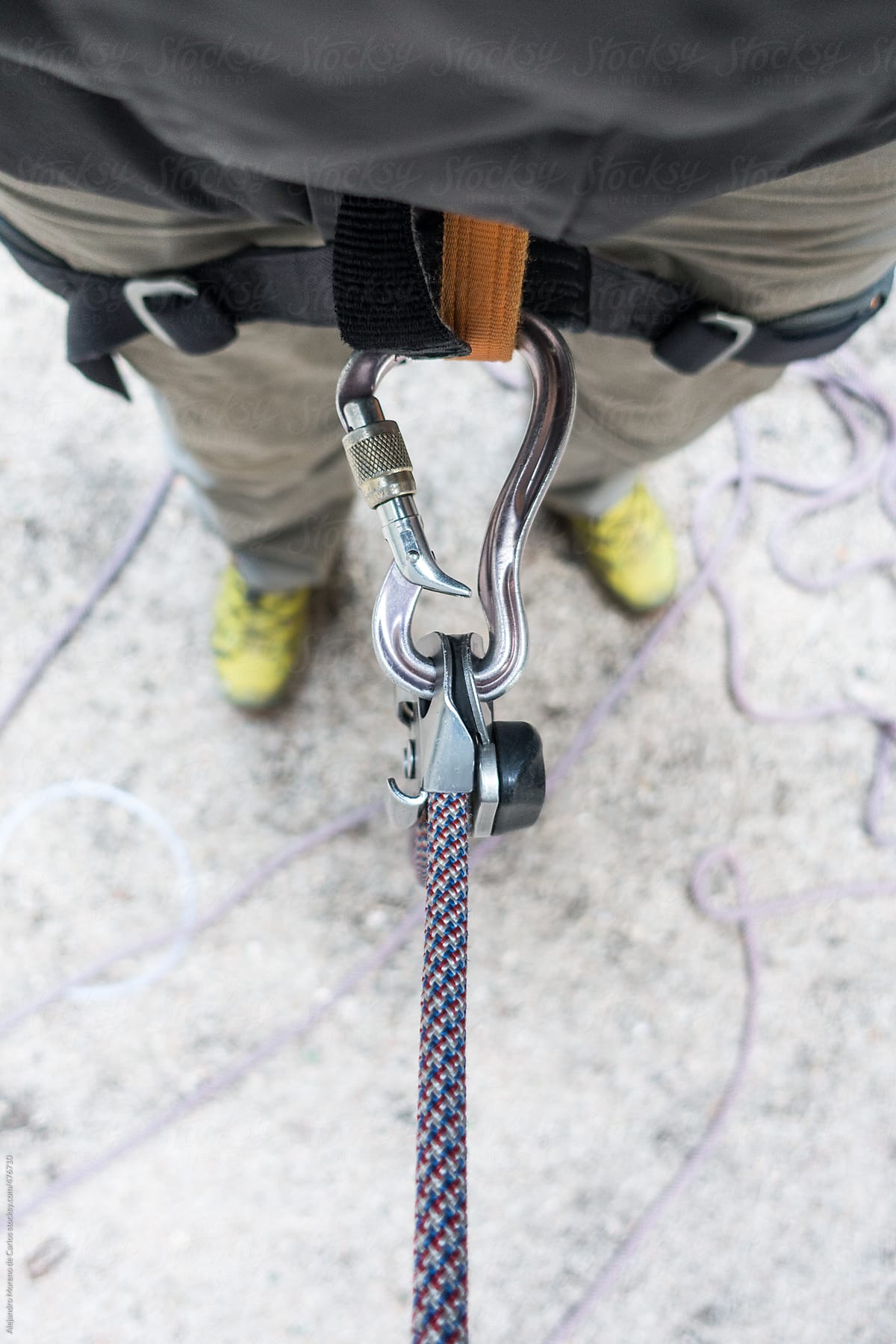 POV view of a man belaying in rock climbing