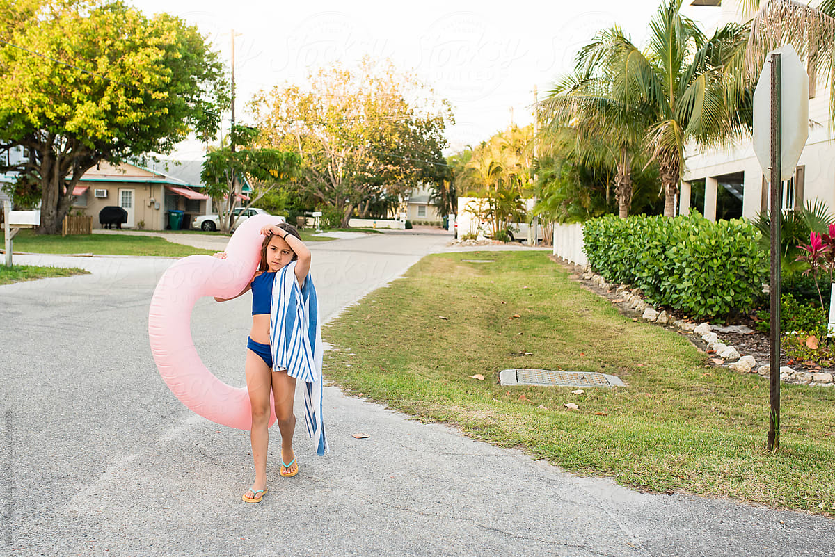 Girl Going To Beach With Pink Float