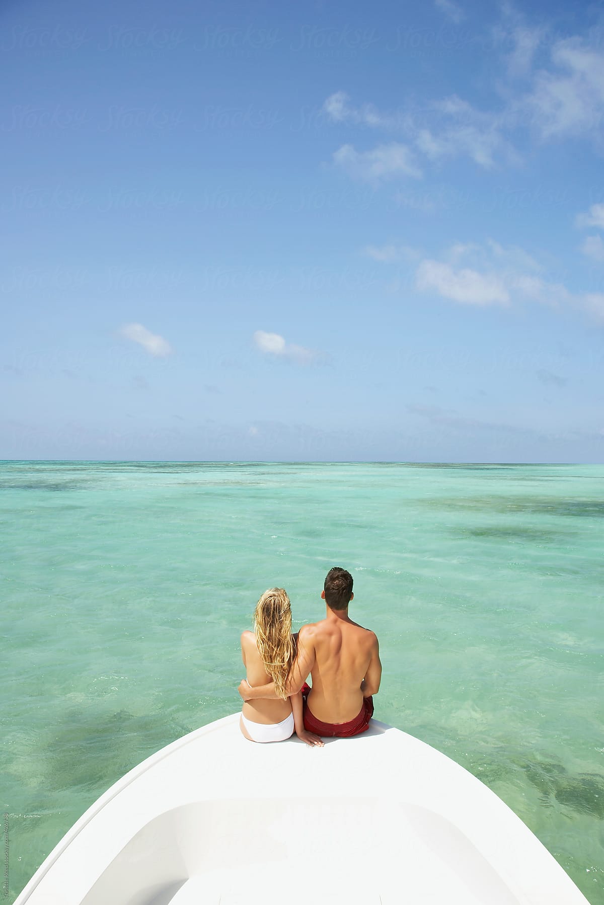 Couple relaxing on vacation on a boat in the Caribbean