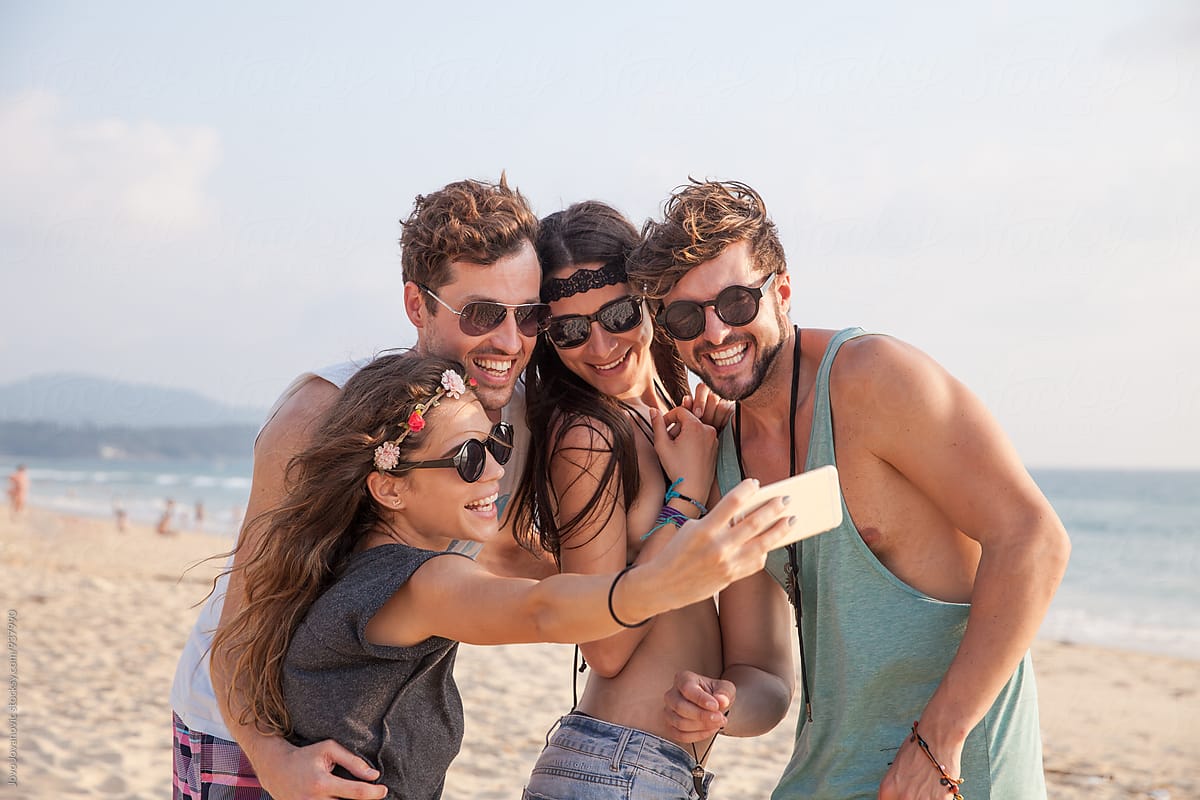 Group Of Friends Taking A Selfie Together On The Beach By Jovo Jovanovic 