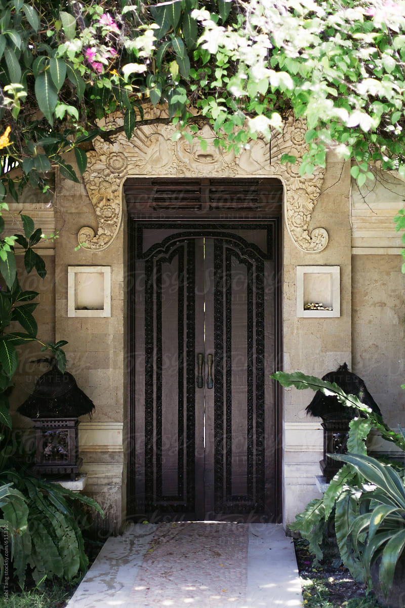 Wooden door in front of the luxury villa in Bali