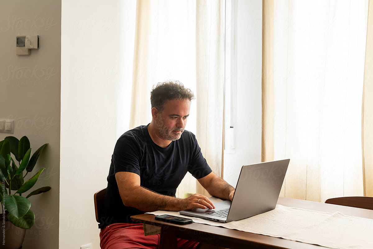 Man Using Computer Indoors