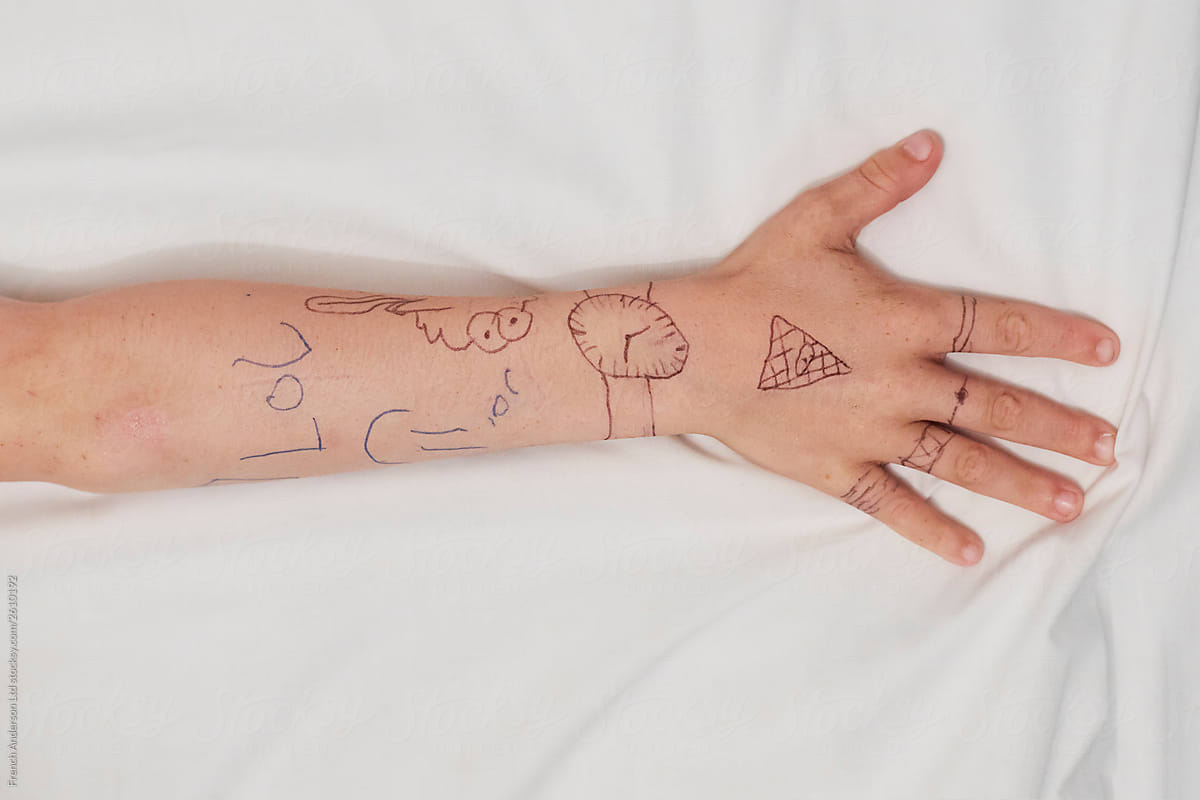Boy's Hand With Pen Tattoos Landscape
