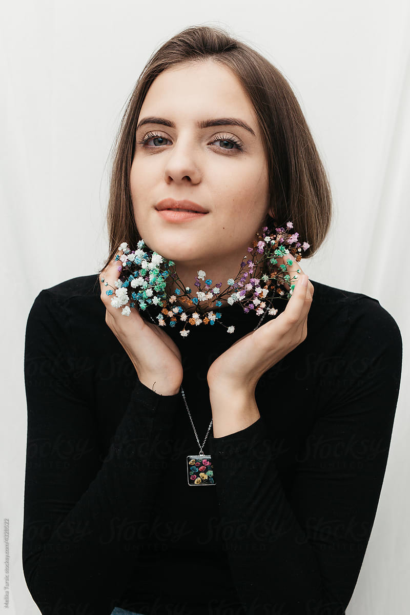 woman wearing floral epoxy necklace