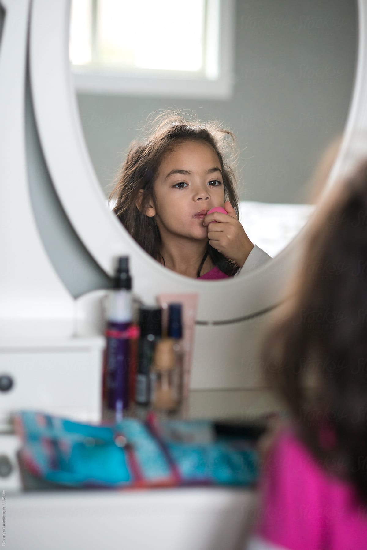Girl Using Mom\'s Makeup Mirror
