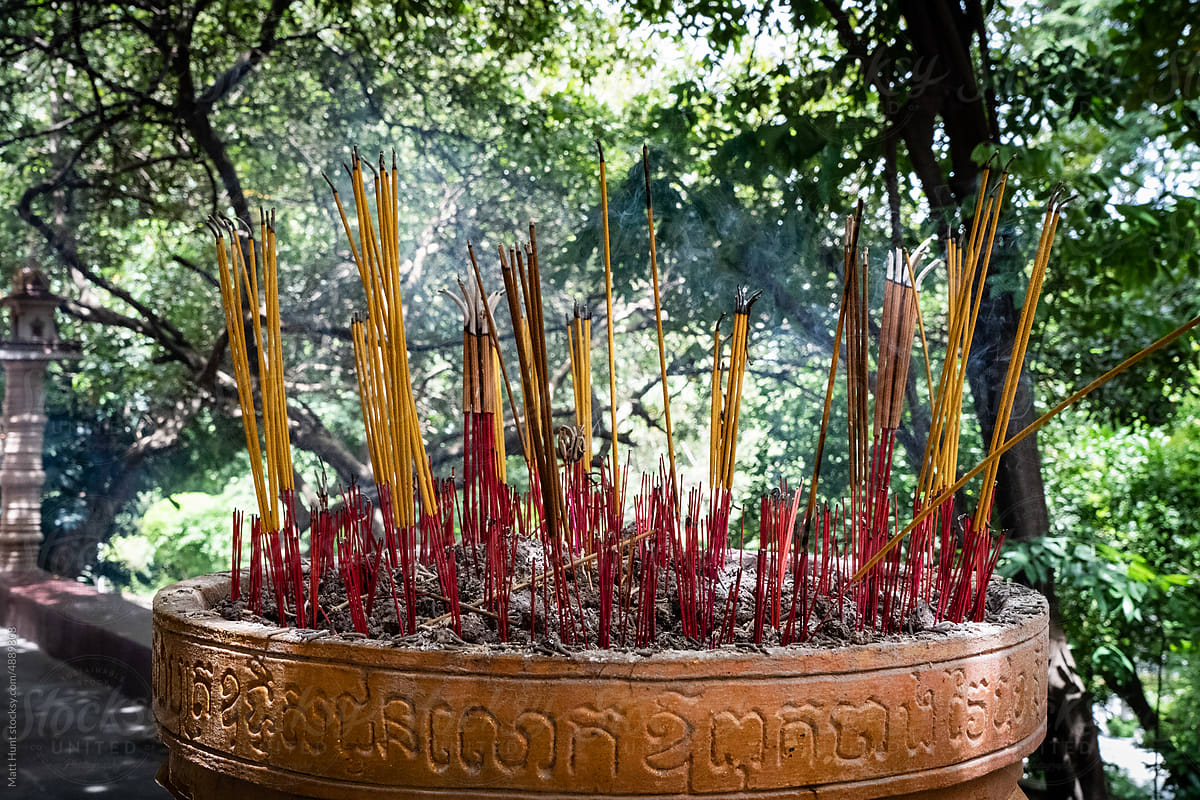 Burning incense sticks at a Buddhist temple in Cambodia